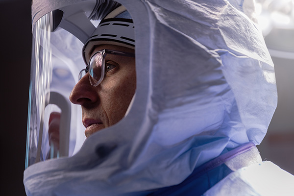 Physician using Mako™ robotic arm to perform surgery