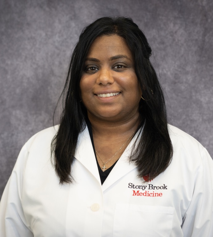 steph rawana chief Resident in a Doctor's white coat with a gray background
