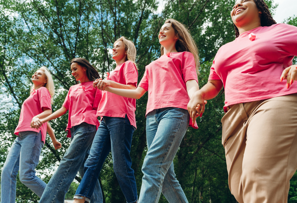 Group of women holding hands walking